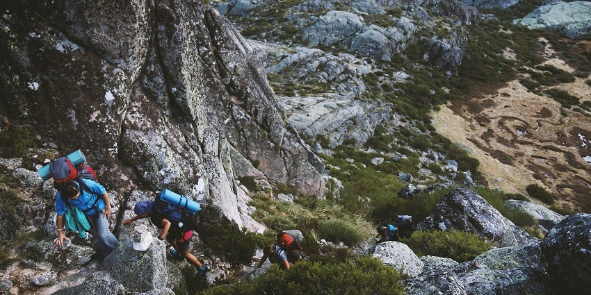 A glimpse of people trekking through the rocky terrains and majestic mountains in Odisha.