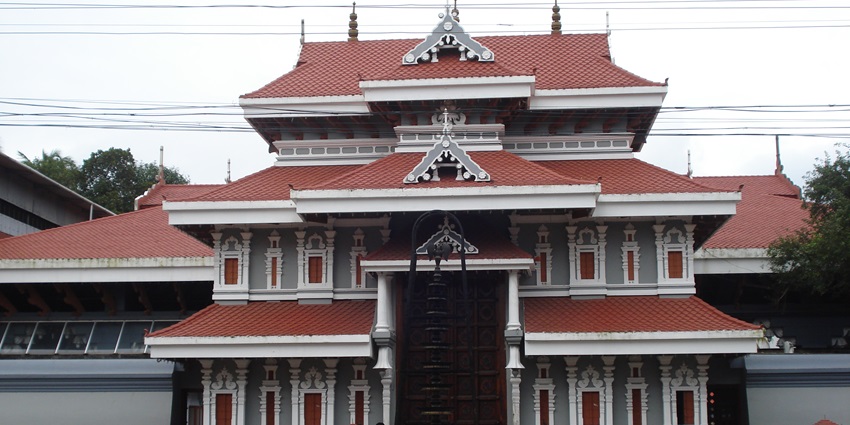 Thiruvambadi Sri Krishna Temple with multiple tiered roofs and intricate grey detailing