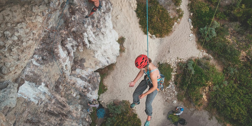 Thrill-seekers climbing mountains like in Thrill Zone for adrenaline rush adventure.