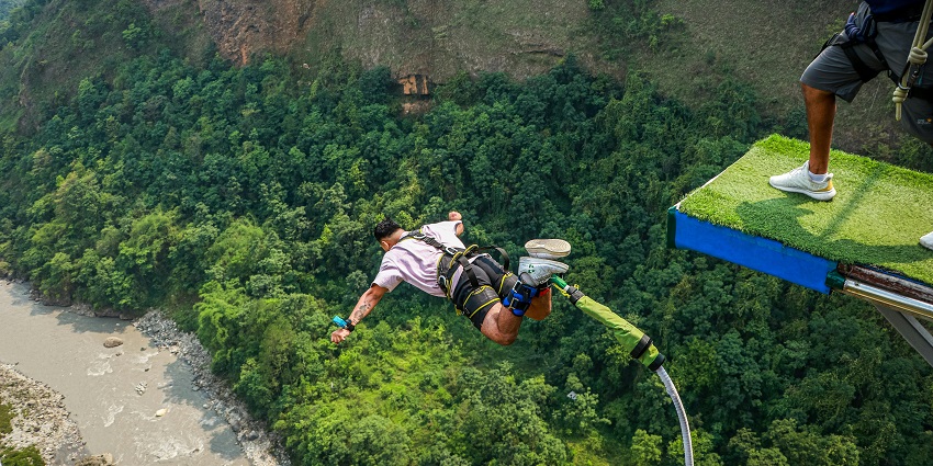 A mesmerising view of a person enjoying an activity with greenery in the background.