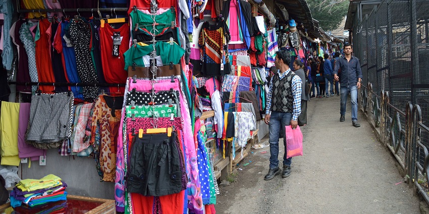 Tibetan Market has complex silver jewellery, coloured prayer flags, traditional Thangka paintings and woollen items.
