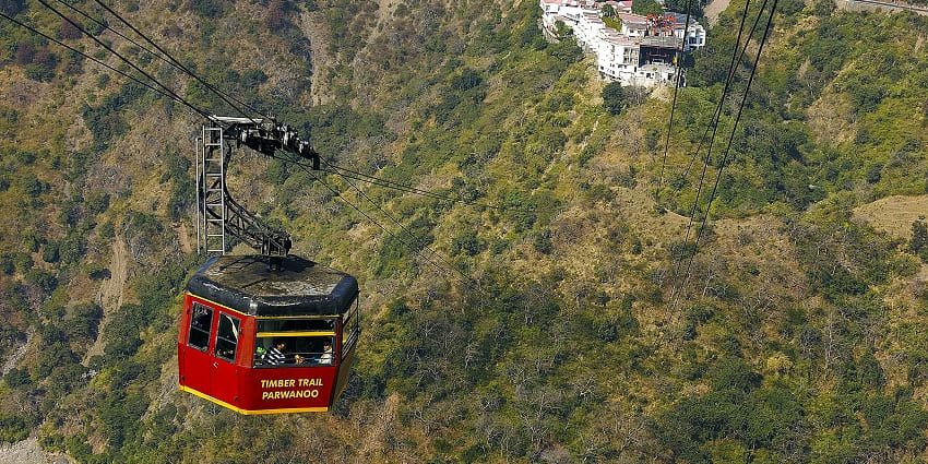Timber Trail at Parwanoo, Himachal Pradesh, featuring scenic cable cars and lush hills in the background