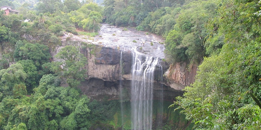 The serene Tincha Falls against a peaceful backdrop