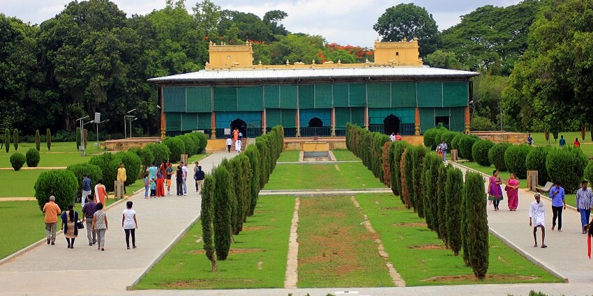 The view of Tipu Sultan Palace surrounded by lush greenery.
