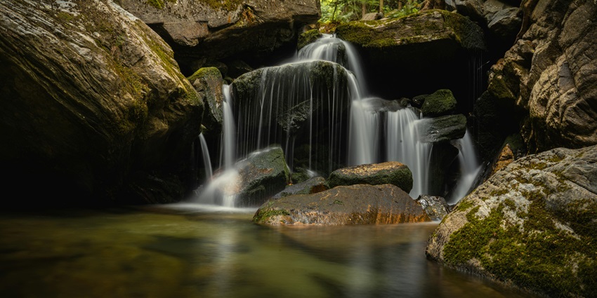 Tirathgarh, cascading amidst dense forest, is a must-visit near Chitrakote Waterfalls.
