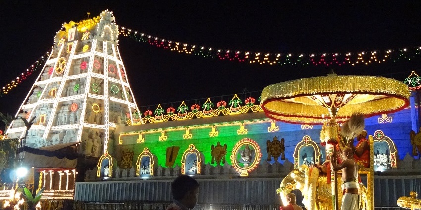 Enchanting view of Venkateswara temple illuminated by lights for the festival celebration