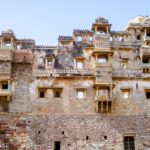 Panoramic view of Todgarh Fort amidst lush greenery, showcasing its natural grandeur