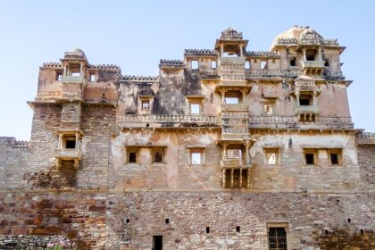 Panoramic view of Todgarh Fort amidst lush greenery, showcasing its natural grandeur