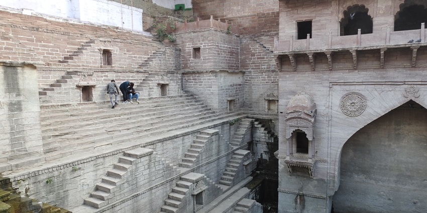 Toorji Ka Jhalra is a historic stepwell in Jodhpur with ornate sandstone architecture.