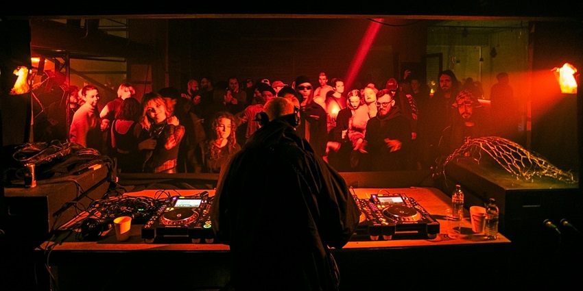 People enjoying electric music in the Top House Bangkok, a nightclub in the city