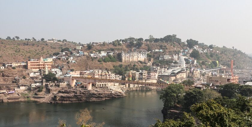 A scenic view of Omkareshwar from the Narmada River which is a top tourist attraction