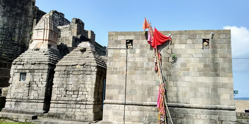 Kangra Fort in Himachal Pradesh, India, showcasing ancient architecture and hills.