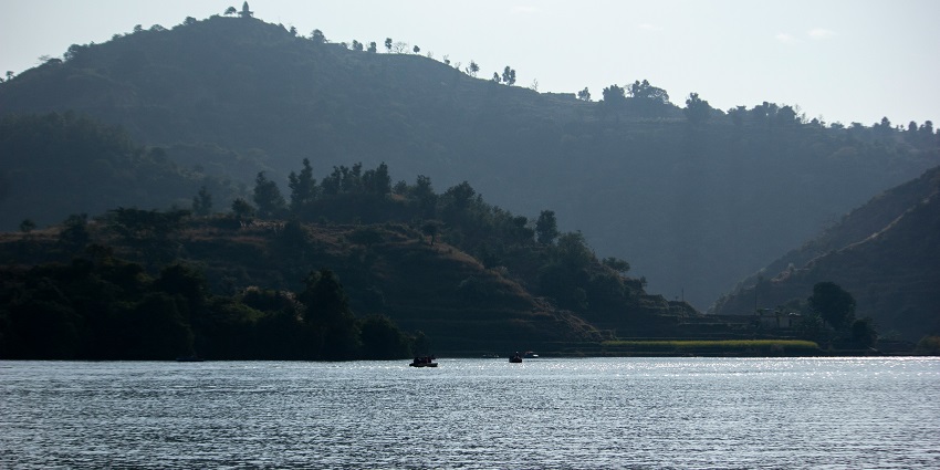 Enjoy boating on the calm waters of Tikkar Taal in Morni Hills surrounded by greenery.