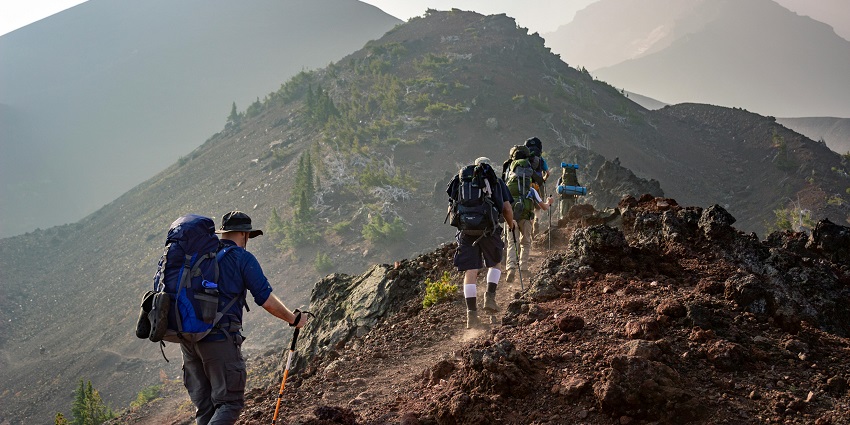 Image of people on trek on the mountains with their backpack carrying during day time