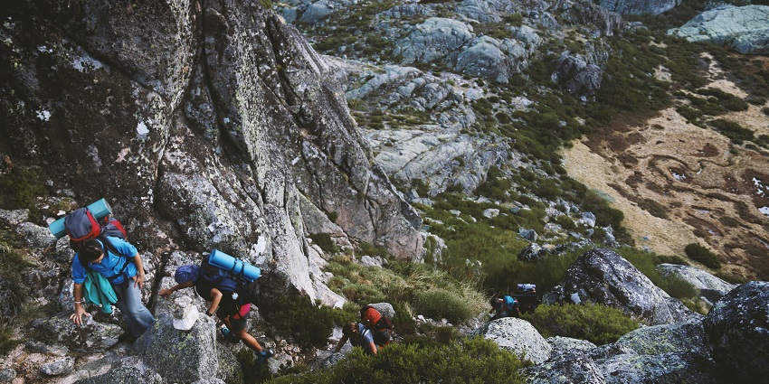 A glimpse of people trekking through the rugged terrain to reach Parasnath Temple.