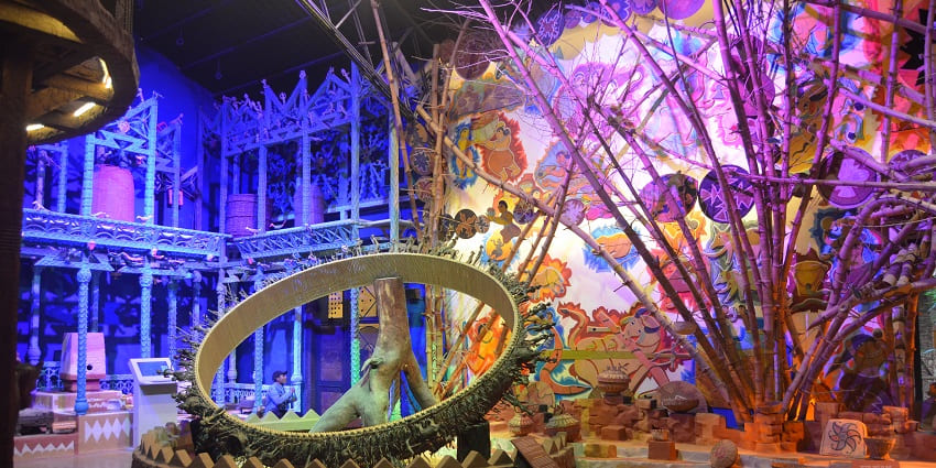 A section showcasing intriguing tribal art and traditional costumes at the Tribal Museum in Ahmedabad