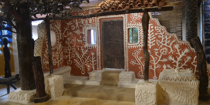 An view of the interiors of Tribal Museum during the night featuring intricate designs.