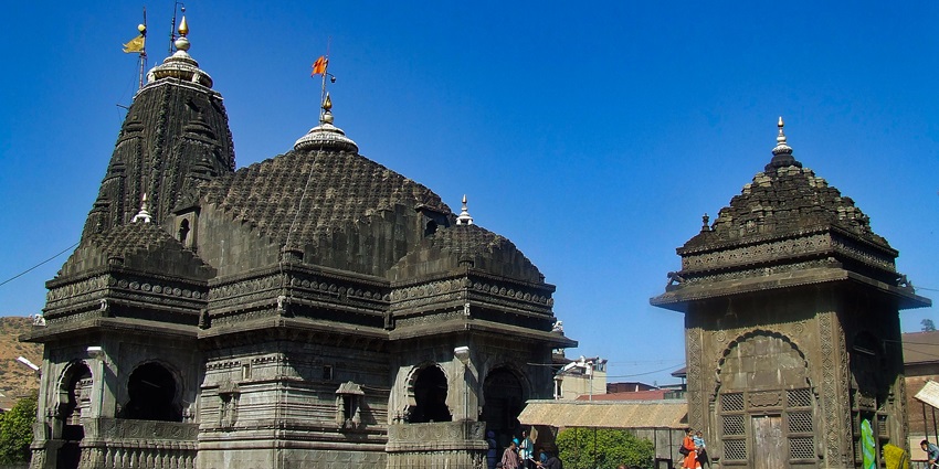 Devotees gather at the Trimbakeshwar Temple, known for its black stone carvings.