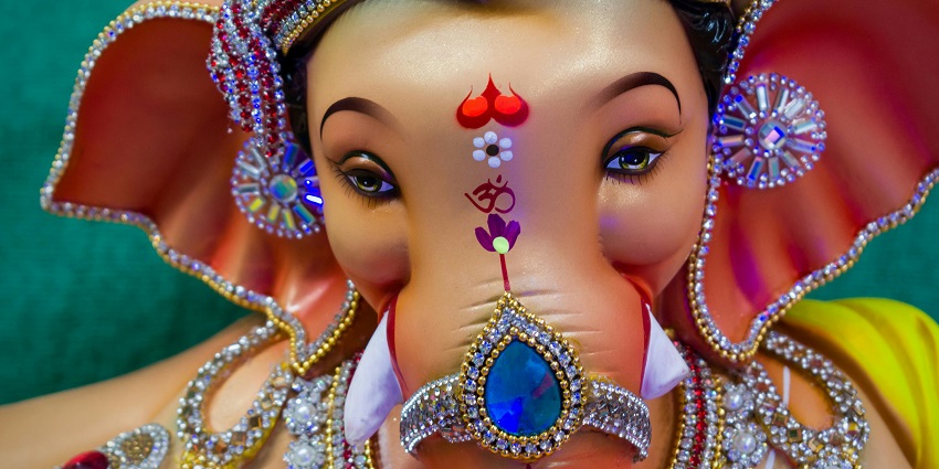 Close-up shot of a beautifully crafted Lord Ganesha statue, featuring intricate details.