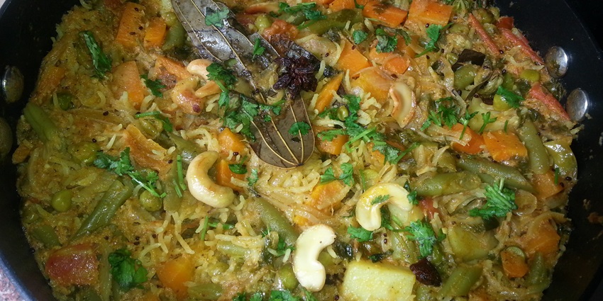 A plate of spicy Andhra delicacies, including Gongura Pachadi and Pulihora.