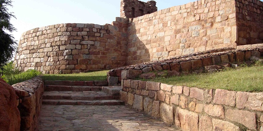 Tughlaqabad Fort contains massive walls and bastions and Ghiyasuddin Tughlaq's Tomb.