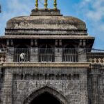 Places to visit near Tuljapur featuring entrance of the temple made up of black granite.