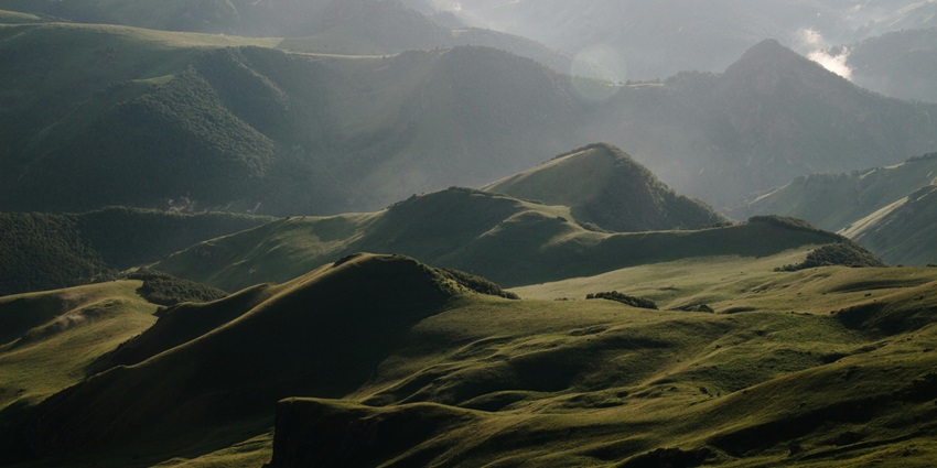 Image of lush green hills under clear blue sky somewhere in Nagaland, India