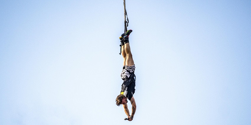 A mesmerising view of a man enjoying an adventurous activity during the daytime.