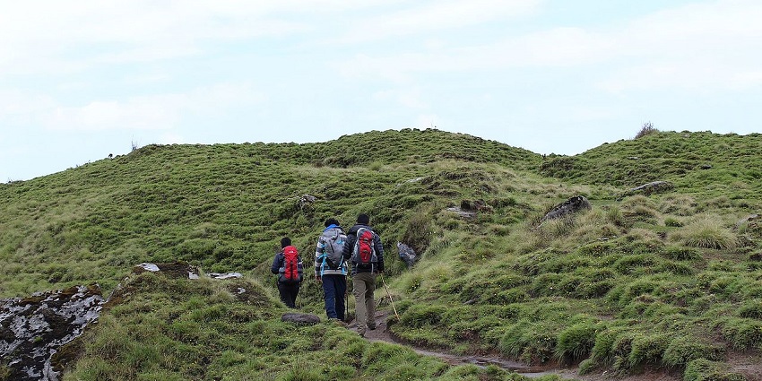 People trekking in Goa amidst the fourth-highest peak in Goa.