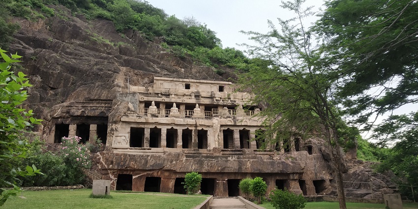 Ancient rock-cut caves in Undavalli, showcasing intricate carvings and historical significance.