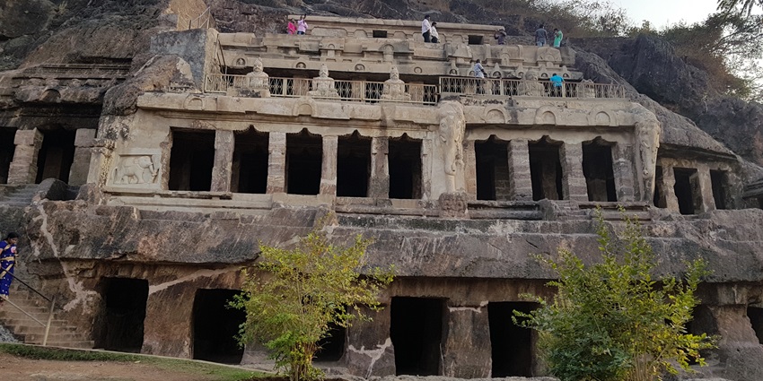 Stone façade of four-storey Undavalli Caves carved into a hillside near Vijayawada
