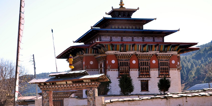 An image of the historic Ura Mang gi Lhakhang, set amidst scenic views for picnicking.