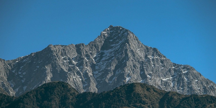 A stunning view of Moonpeak at Triund, with rugged mountain terrain under a clear sky