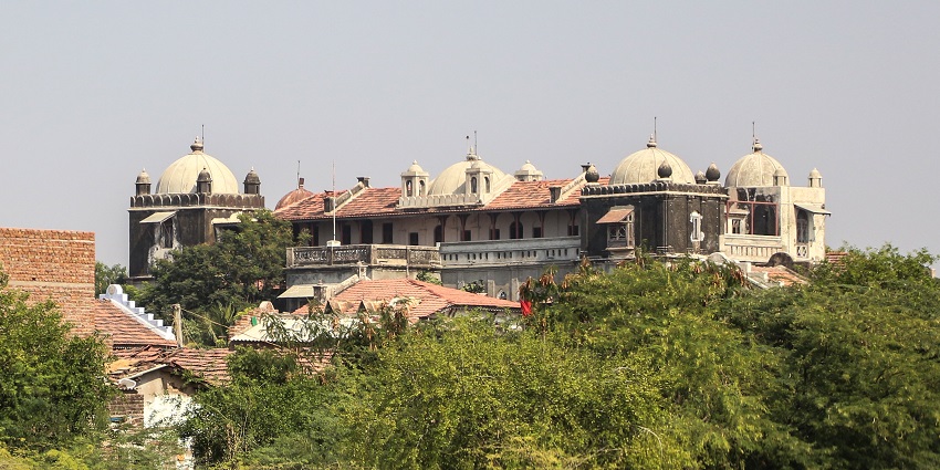 A funtionary Utelia village and the Utelia palace amidst the lush green beautiful trees