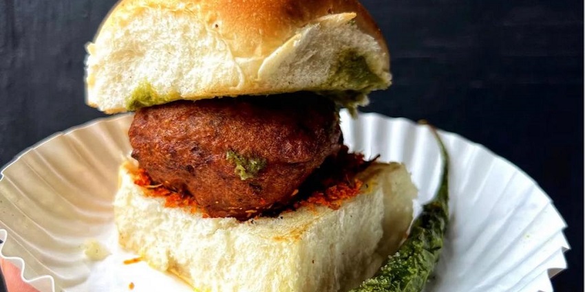 Vada Pav, a spicy potato patty served in a bun, is a famous street food in Anand, Gujarat.