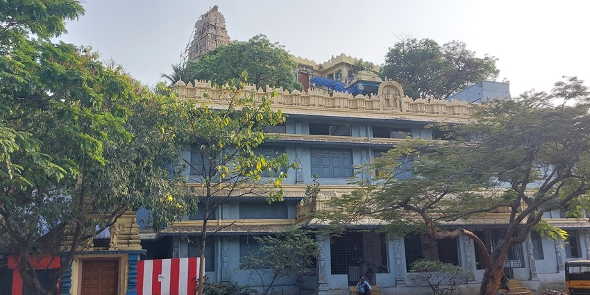 A picture of a traditional temple in Godavari, with trees and greenery all around