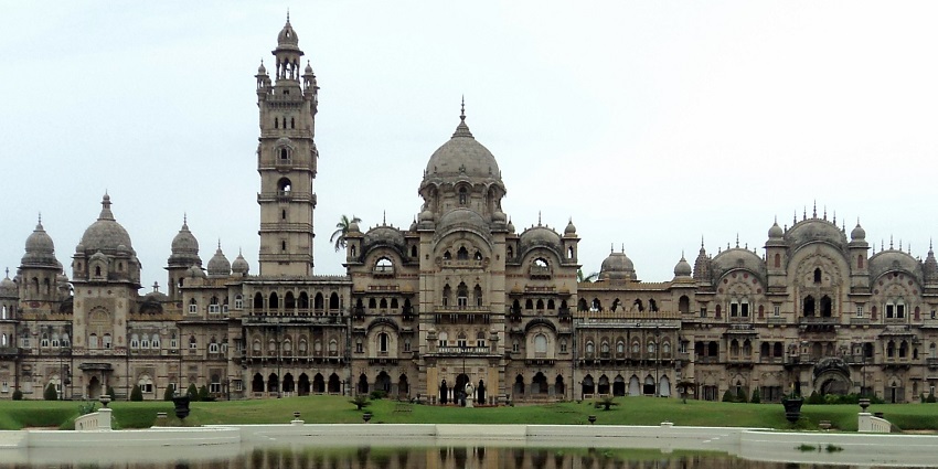 Expansive view of the Vadodara Palace surrounded by lush greenery.