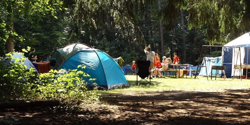 Camping outdoors with unknown people adds to the adventure experience.