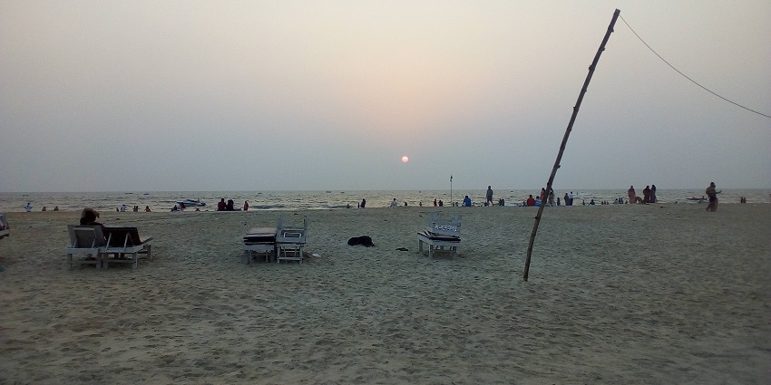 Snapshot of the evening at the Varca Beach where people enjoying the sunset near the Margao