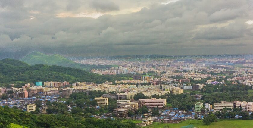 A bird’s eye view capturing the lush rolling hills decked with houses in Maharashtra.