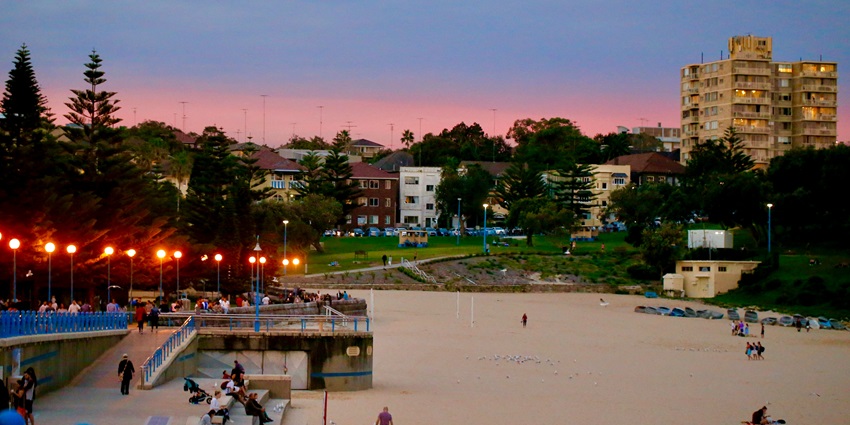 View of the a beach in the Vasco Da Gama city with small shacks illuminated with small lights