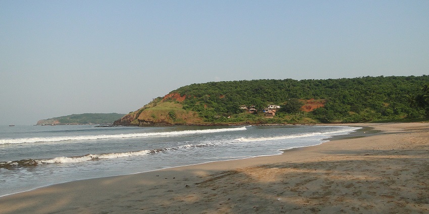 Velneshwar Beach, featuring serene coastline and ancient Shiva temple.