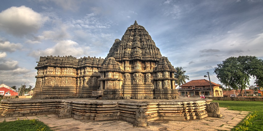 Majestic views of the magnificent hindu temple surrounded by the lush trees and hills