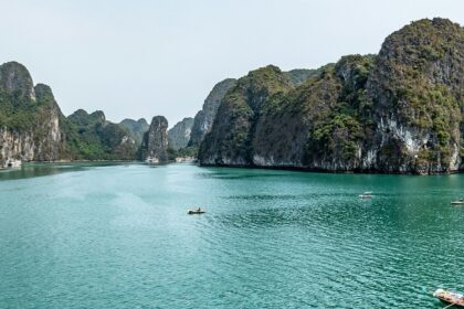 An enchanting glimpse of turquoise-blue waters and towering mountains of Vietnam.