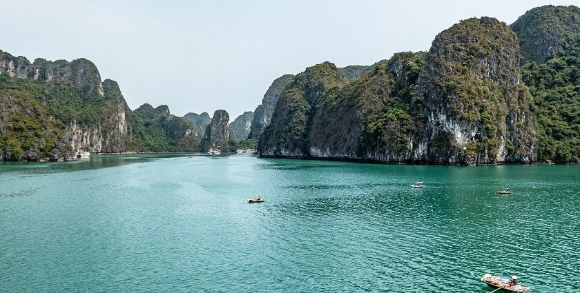 An enchanting glimpse of turquoise-blue waters and towering mountains of Vietnam.