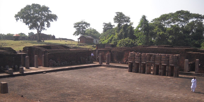 People at Ratnagiri Monastery 1 courtyard with the main stupa at the distant left, Ratnagiri, Odisha.