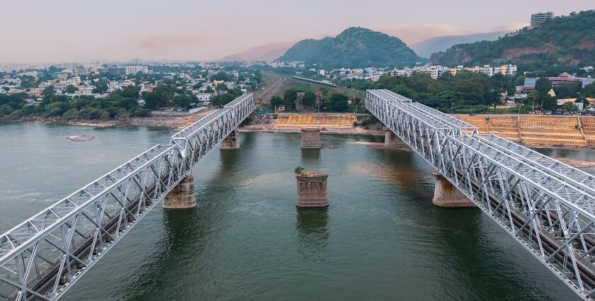 Aerial view of Vijayawada, India, showcasing urban landscape and river on a clear day.