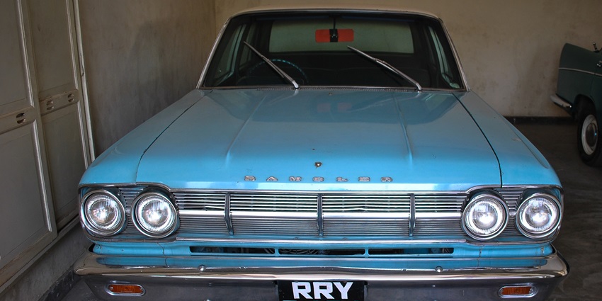 A picture of a restored vintage car placed on display at a museum in Rajasthan