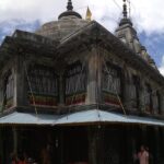 Devotees offering prayers at the sacred footprint of Lord Vishnu in Vishnupad Temple.