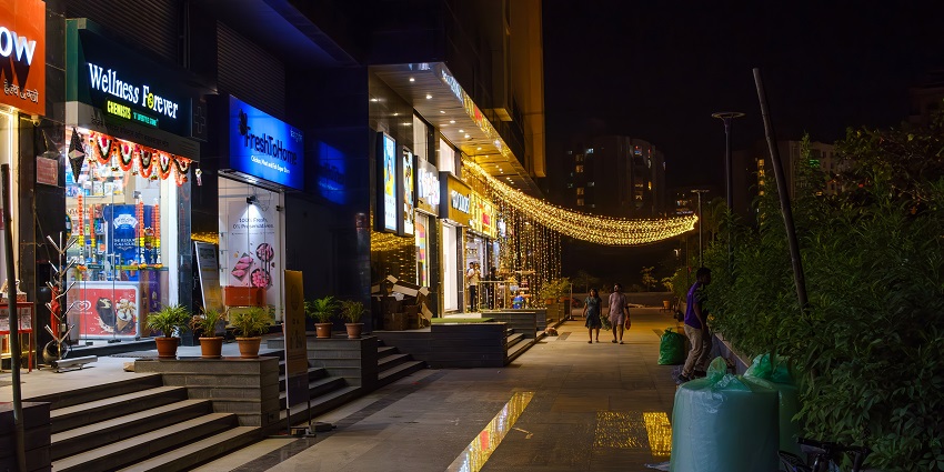 An incredible view of a well lit up shopping complex after sunset at Pune India.